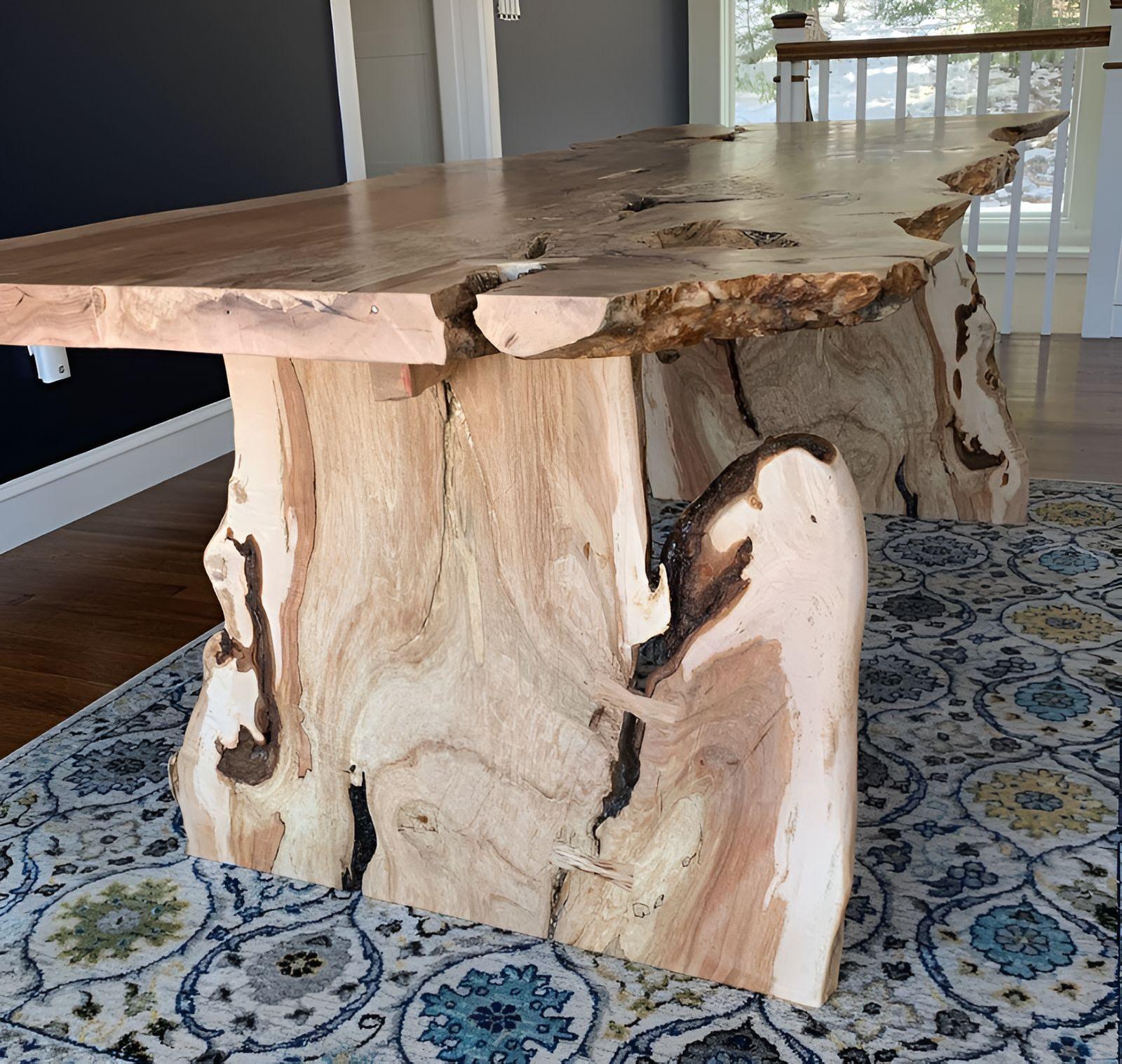Live edge burl table on natural log bases