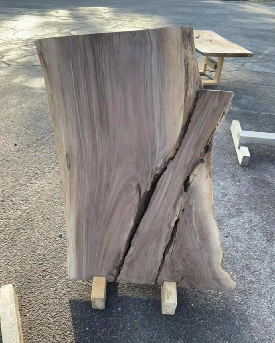 Live edge slab with a natural split, on a stand